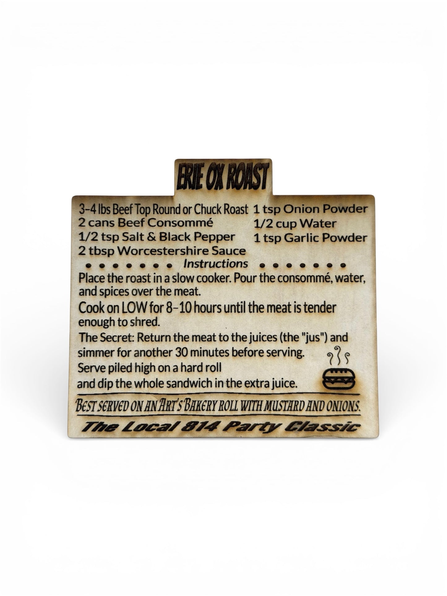 Engraved wood recipe card for "Erie Ox Roast," a local specialty sandwich recipe including slow cooker instructions and serving suggestions for Art’s Bakery rolls.