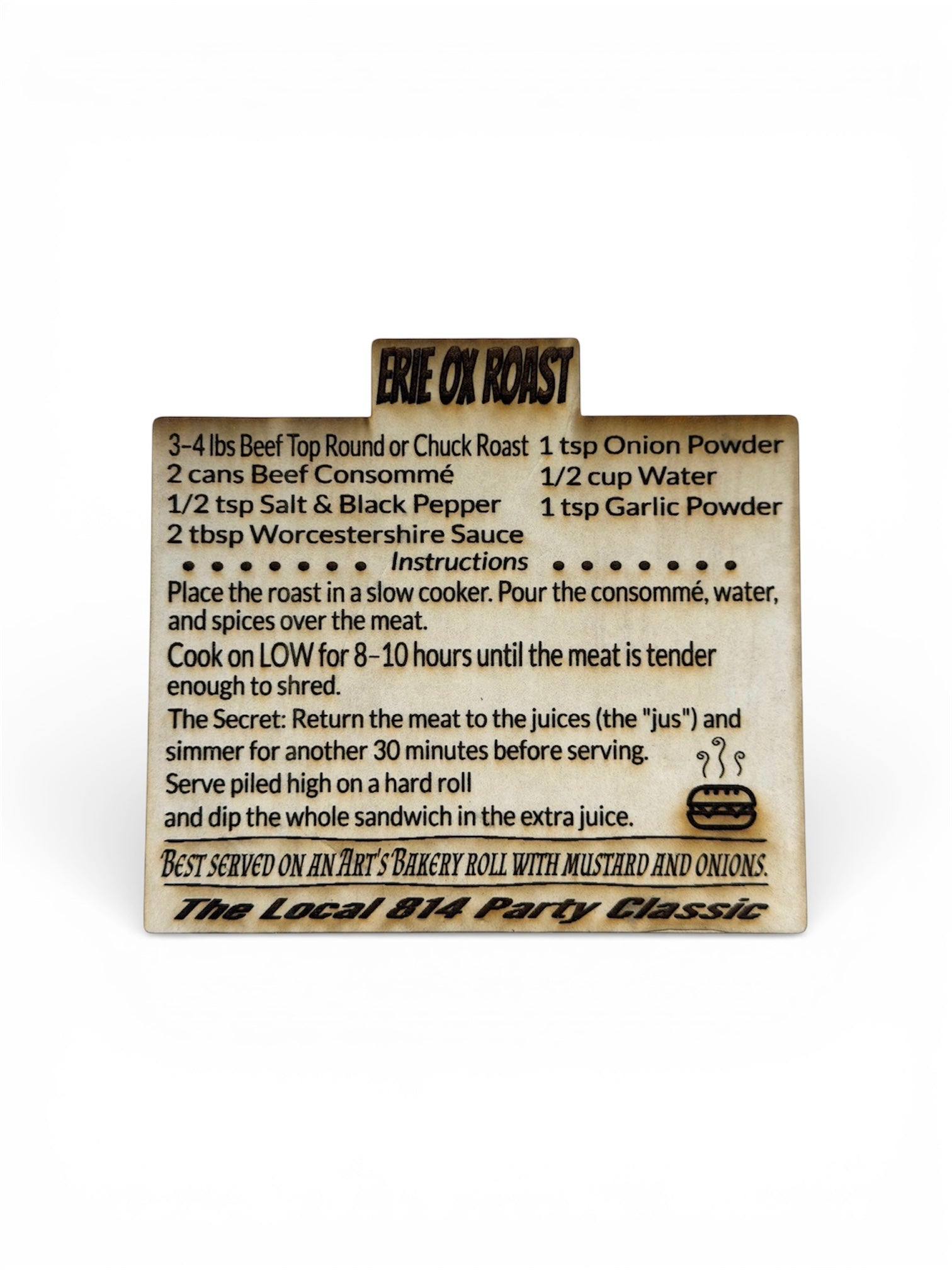 Engraved wood recipe card for "Erie Ox Roast," a local specialty sandwich recipe including slow cooker instructions and serving suggestions for Art’s Bakery rolls.