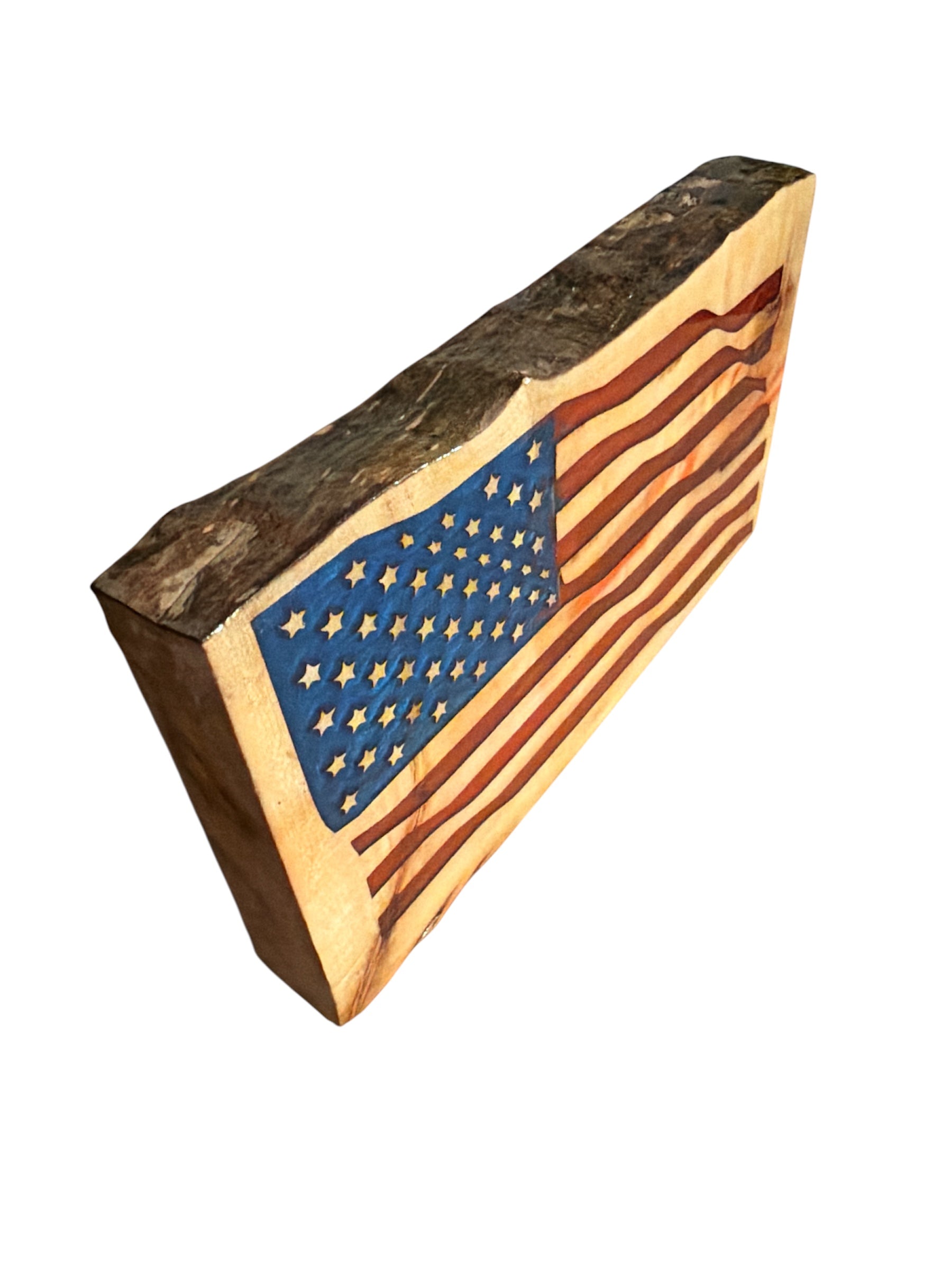 Side view of live edge wood American flag showing 2-inch thickness and natural bark texture with resin coating.