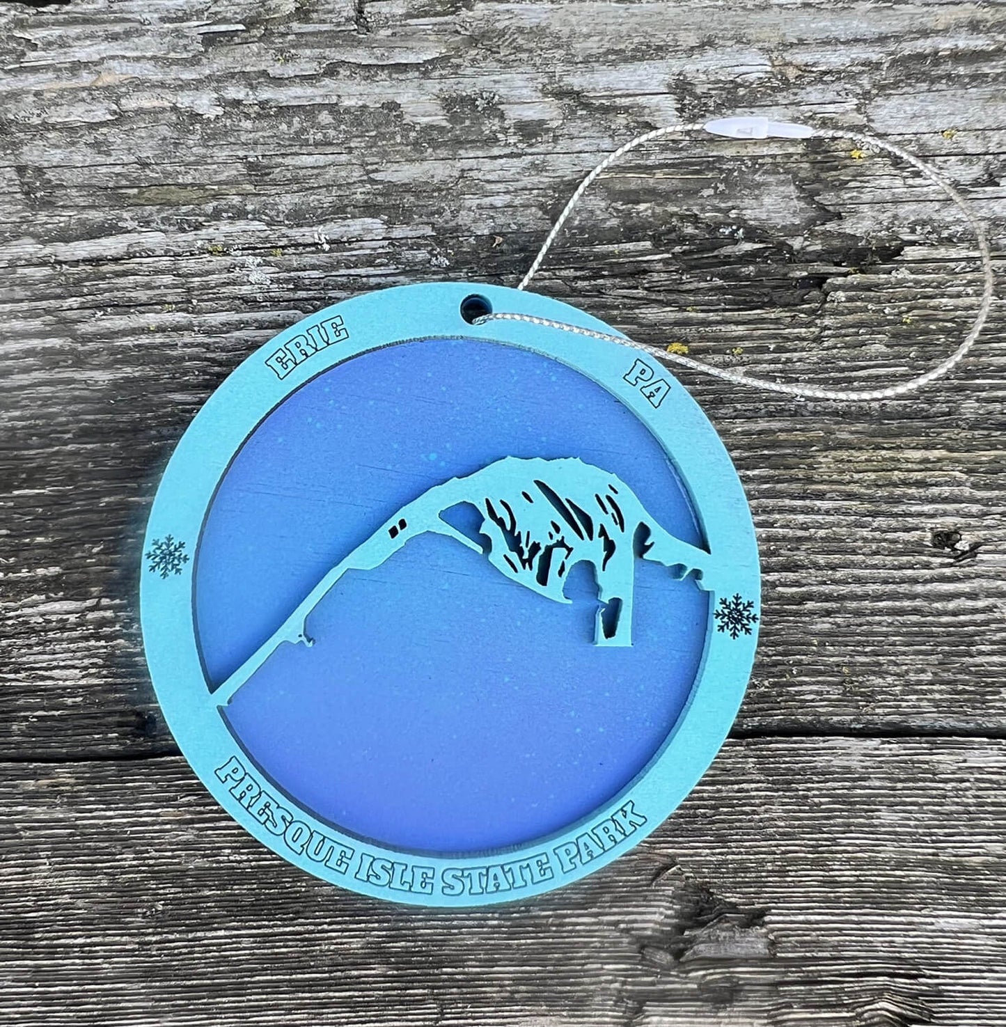 Blue, wooden Presque Isle State Park ornament with string